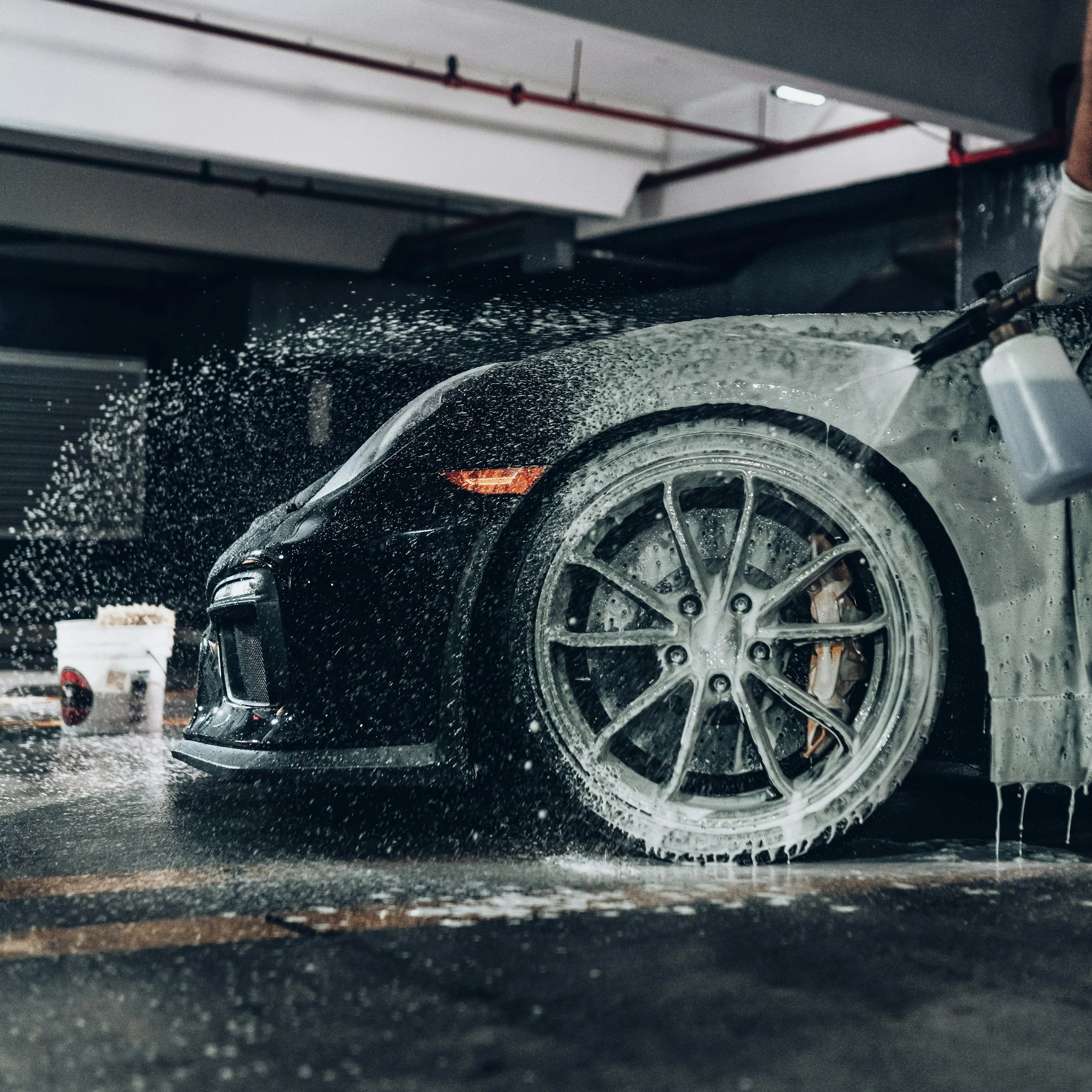 Mobile car wash in progress in Denver, CO,  professional car detailing and car wash at your home