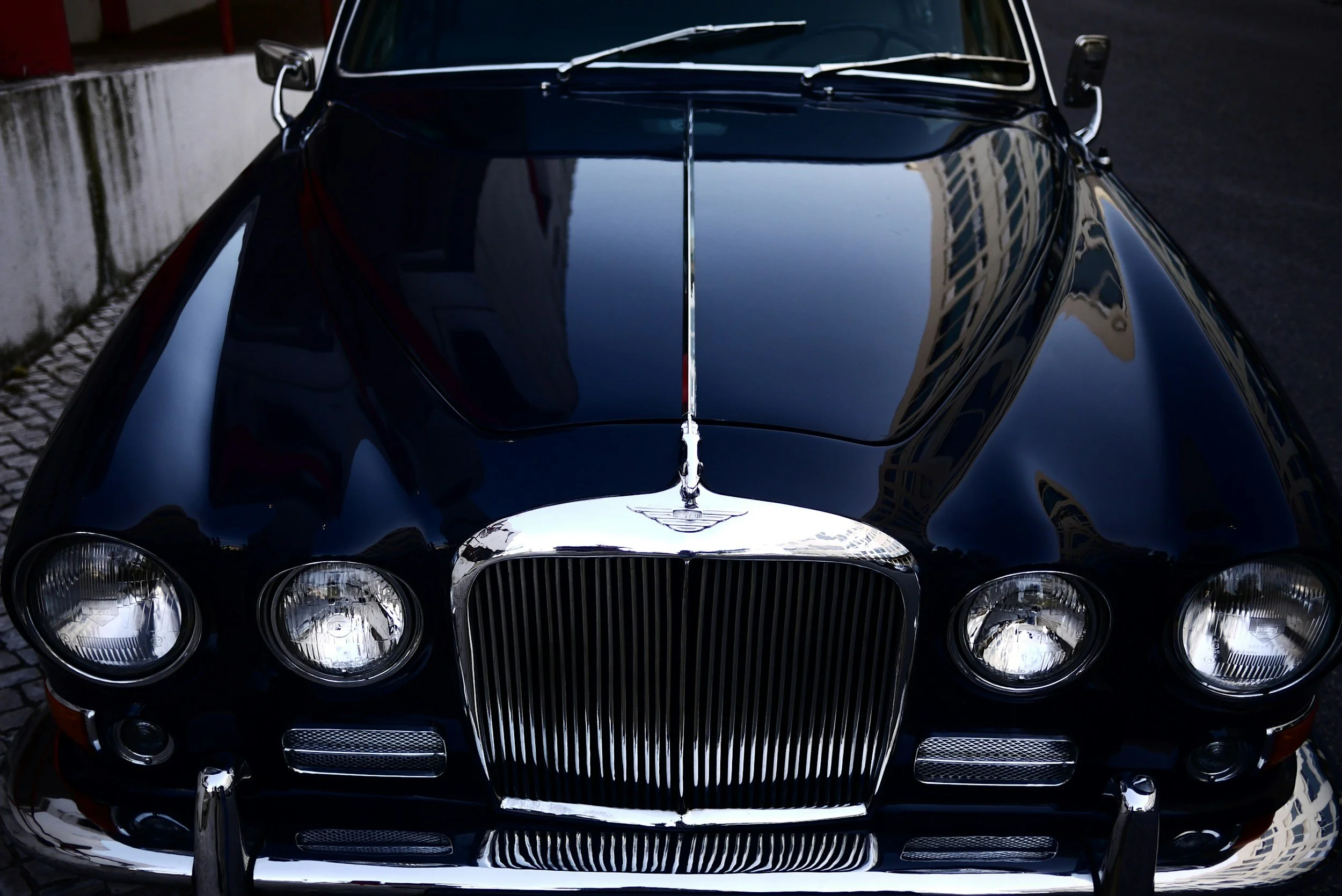 Classic vintage car with chrome grille and headlights in Denver, CO — specialized detailing and ceramic coating for classic and collector cars. headlight restoration